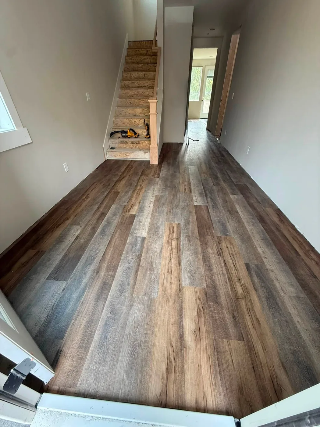 Luxury vinyl plank entry and staircase installation in Snohomish County